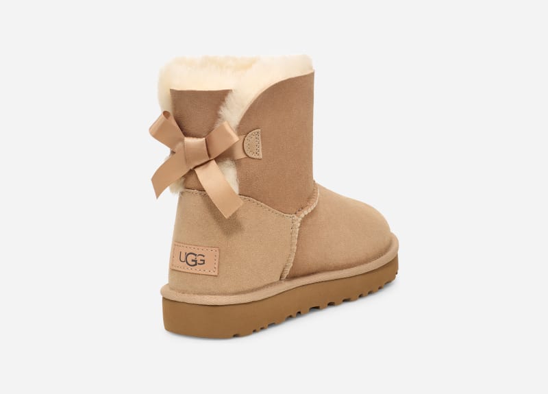 UGG® Mini Bailey Bow II Boot for Women in Tan, Size 5, Suede